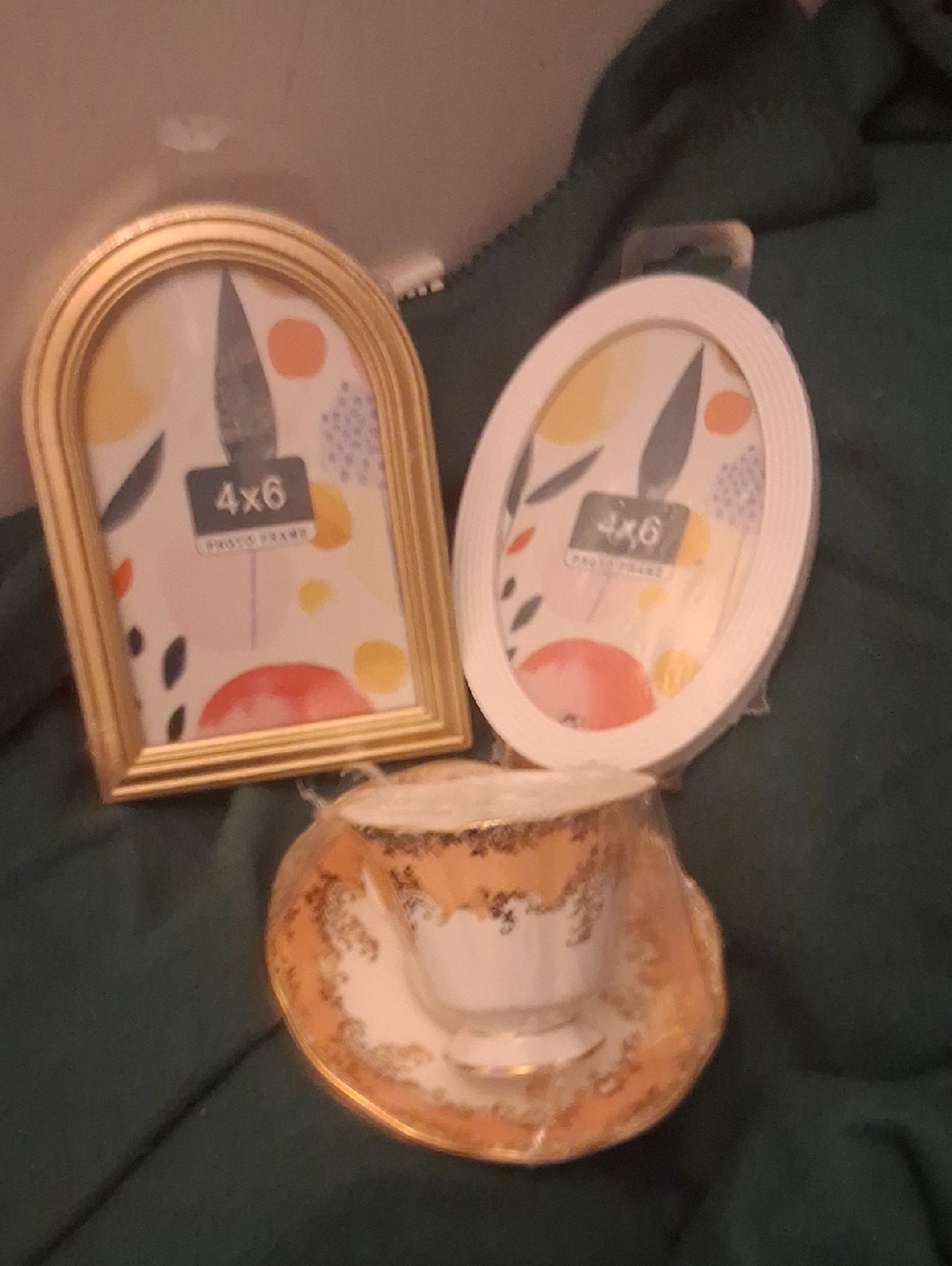 and one gold plated picture frame and one white 4x6